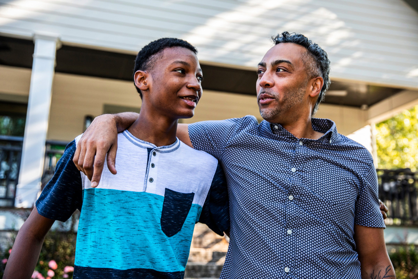 A father and son holding each other