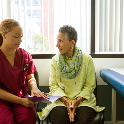 Woman talking to doctor