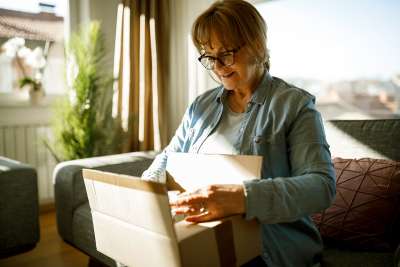 woman opening up package