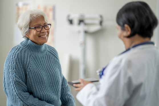 Woman talking to doctor