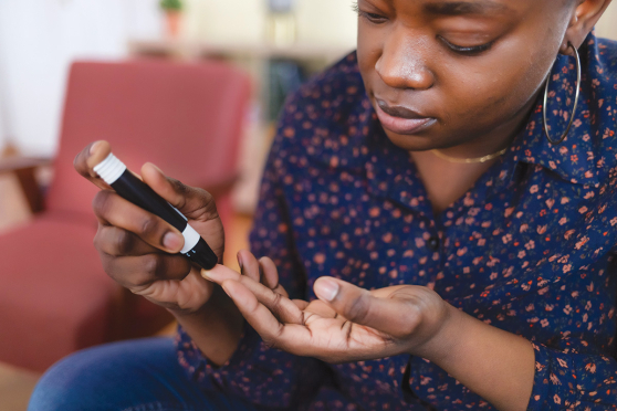 A person checking their blood sugar.