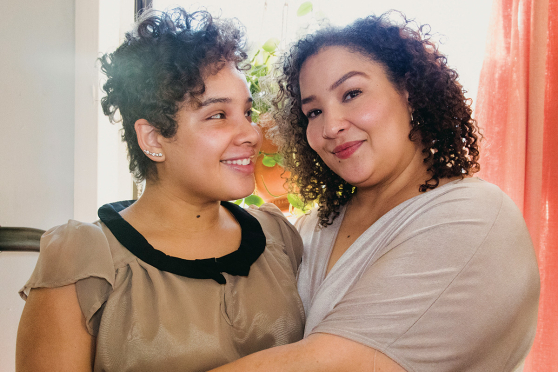 Two women hugging.